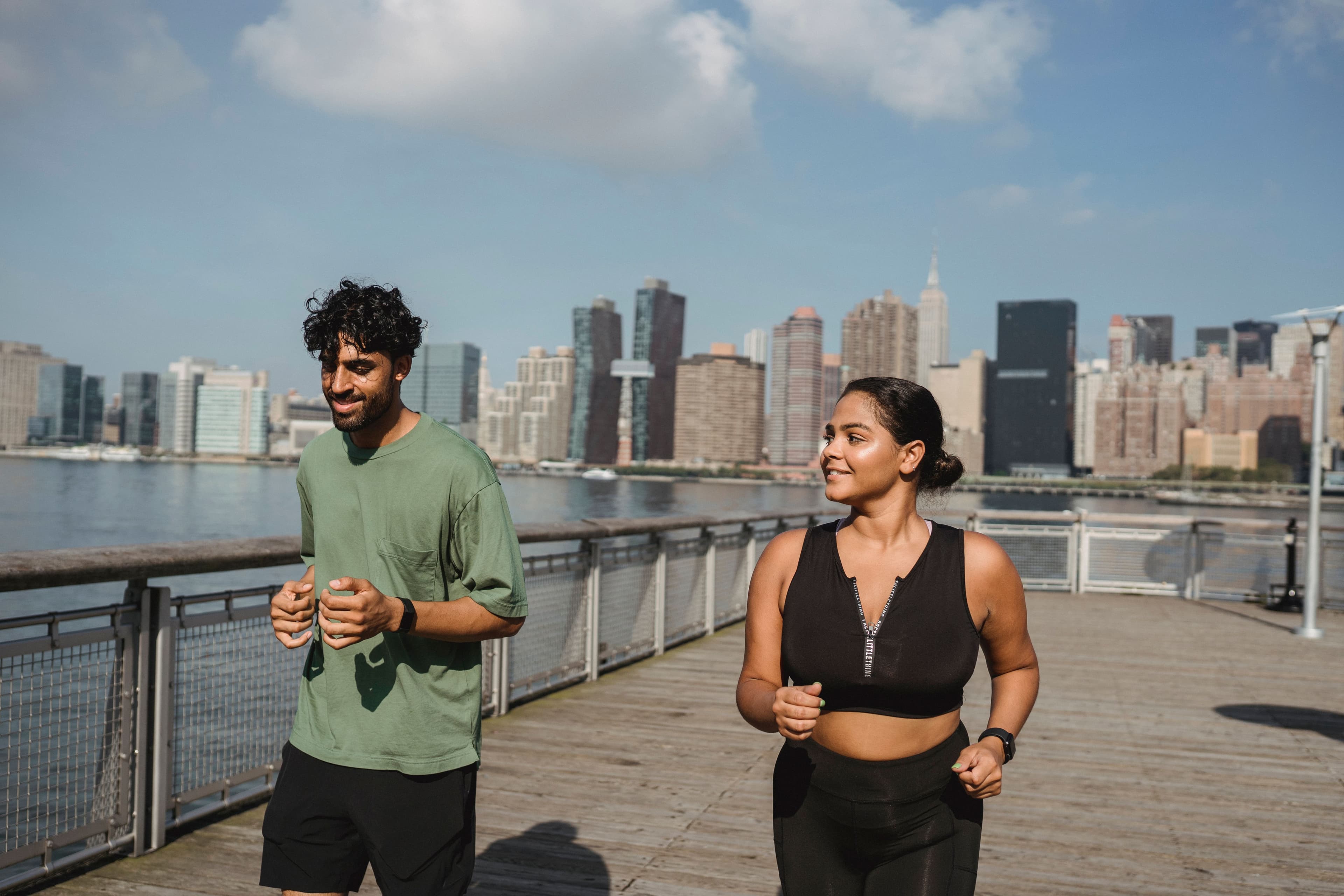 A traveler and a local running together through the city streets